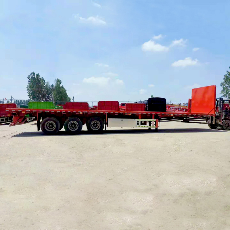  တရုတ်ကုန်ပစ္စည်းစိတ်ကြိုက်အရောင်များ Tri-Axle 80 တန် 3/4/5Axles 40 ပေ သင်္ဘောတင်ကွန်တိန်နာနောက်တွဲ Flatbed Semi Trialer ရောင်းရန်